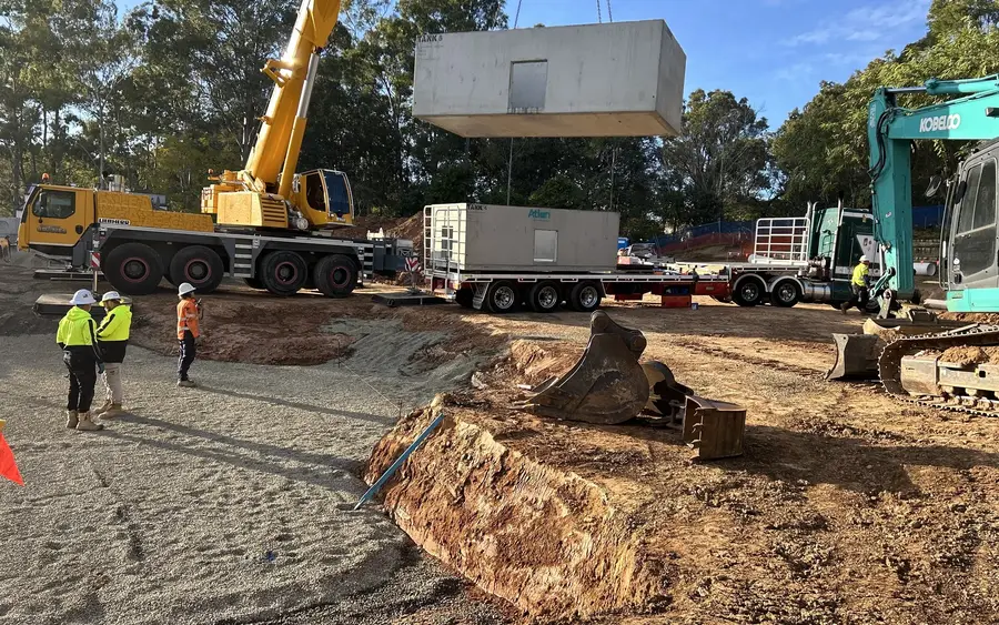 Crane and Kobelco excavator working a commercial site for Earthbound Civil